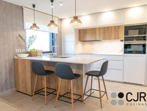 cocinas en blanco y madera con peninsula dekton kairos cocinas cjr