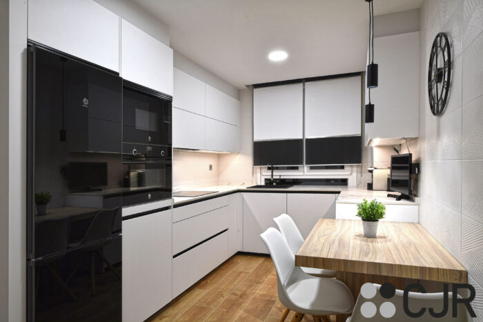 cocina pequeña blanca dekton kairos en u con mesa cocinas cjr