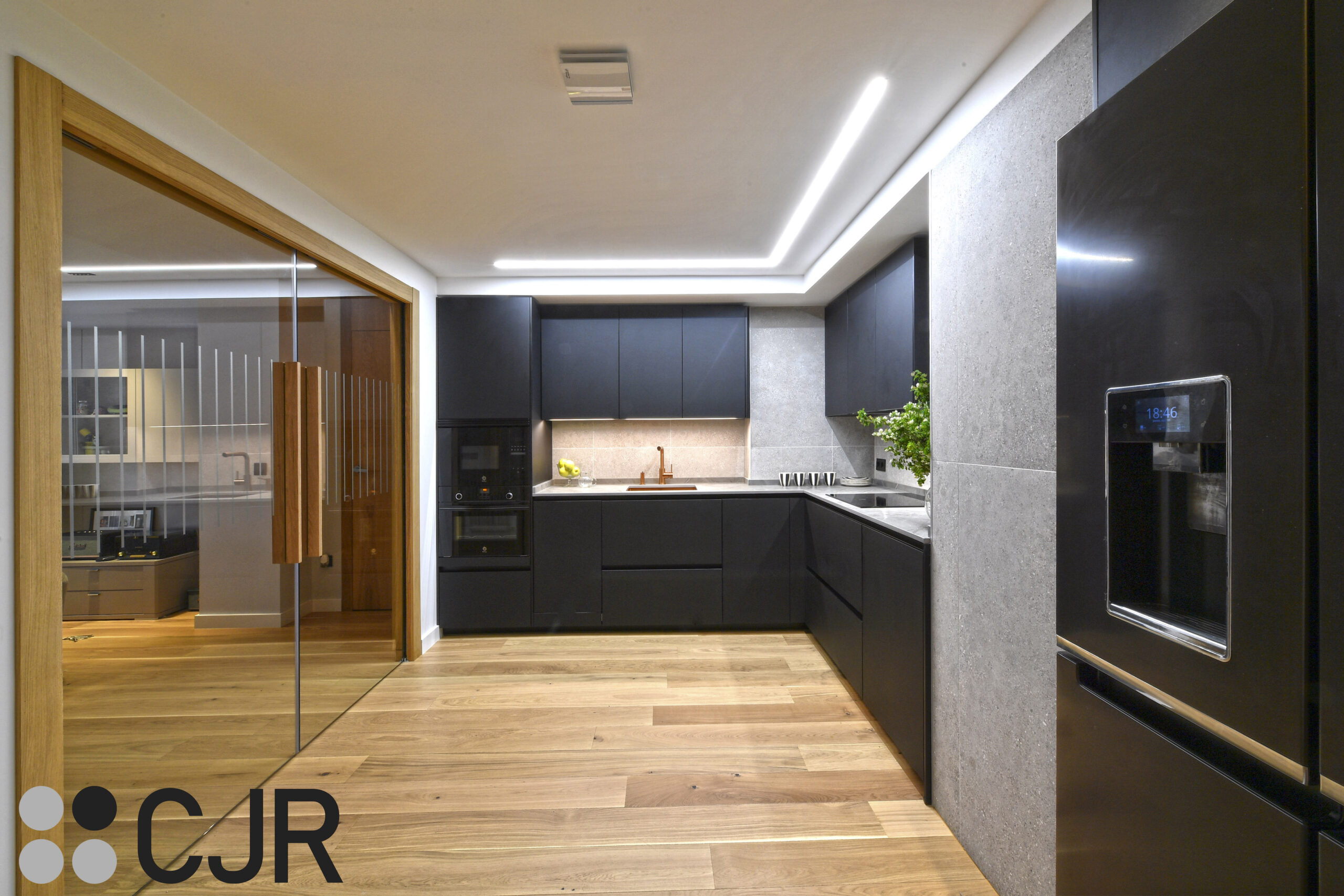 cocina en L moderna en negro mate y encimera dekton vera cocinas cjr