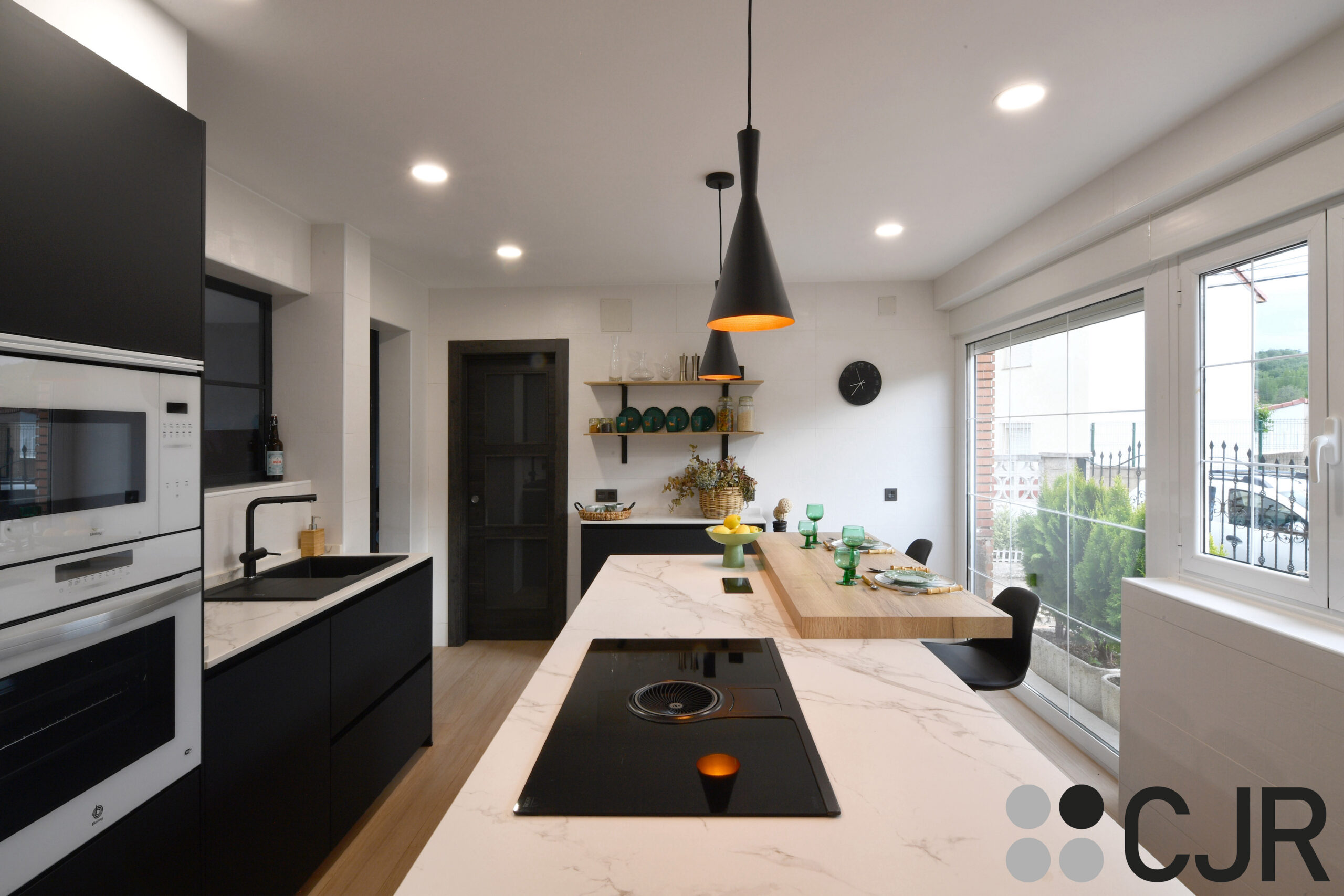 cocina negra mate con isla encimera dekton aura cocinas cjr