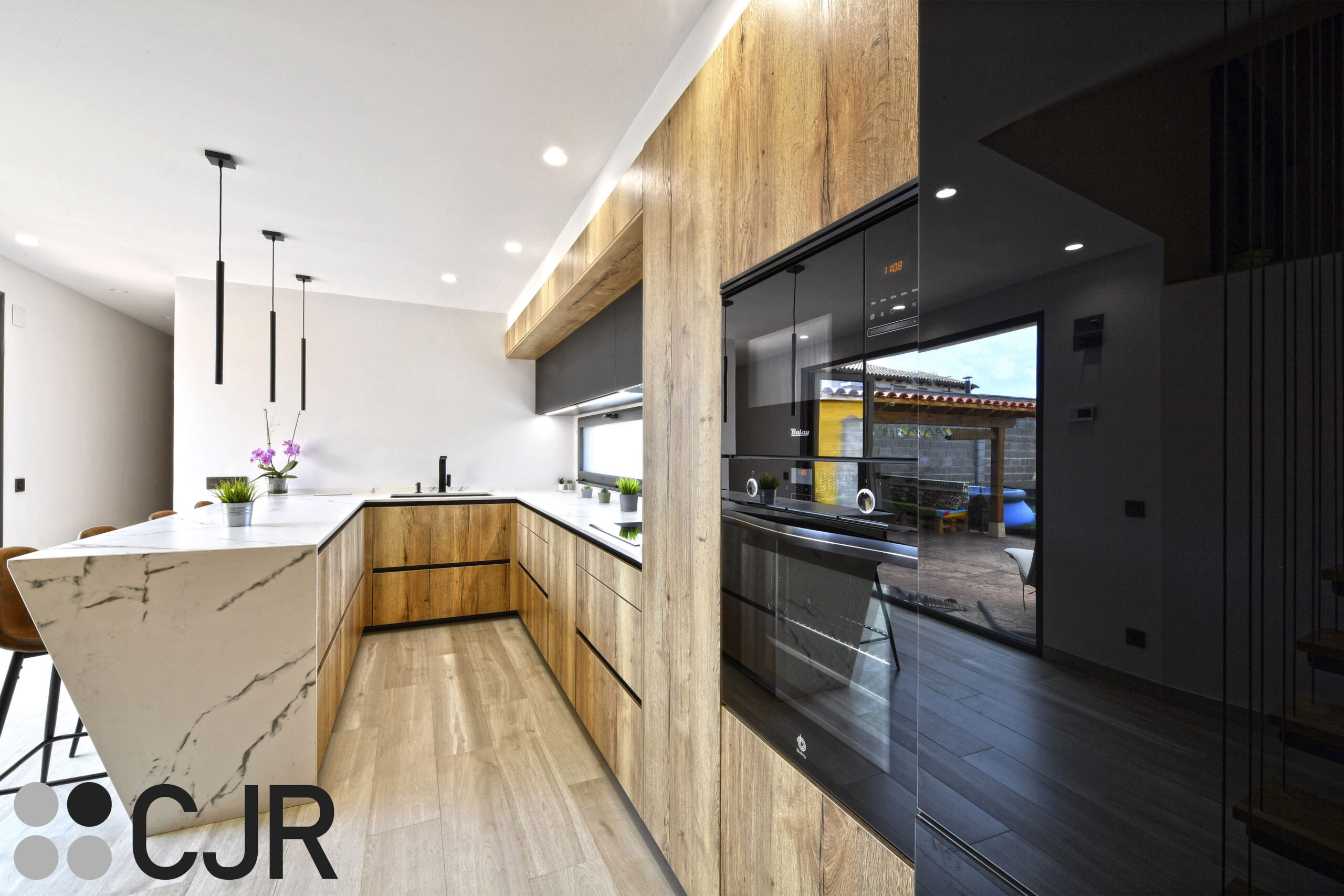 cocinas en u modernas con peninsula madera y dekton kairos cocinas cjr