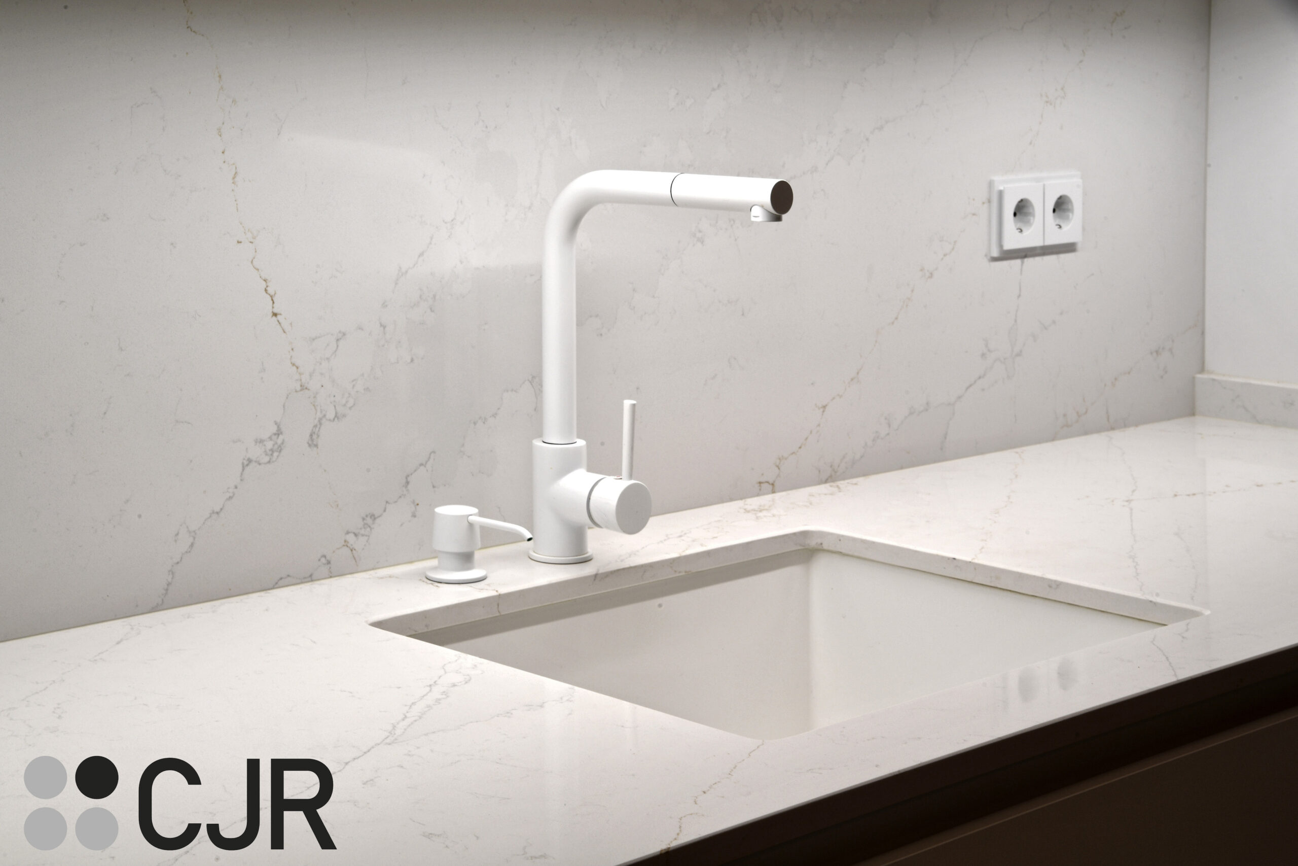 grifo blanco y fregadero blanco en cocina blanca y madera abierta al salon con isla Cocinas CJR