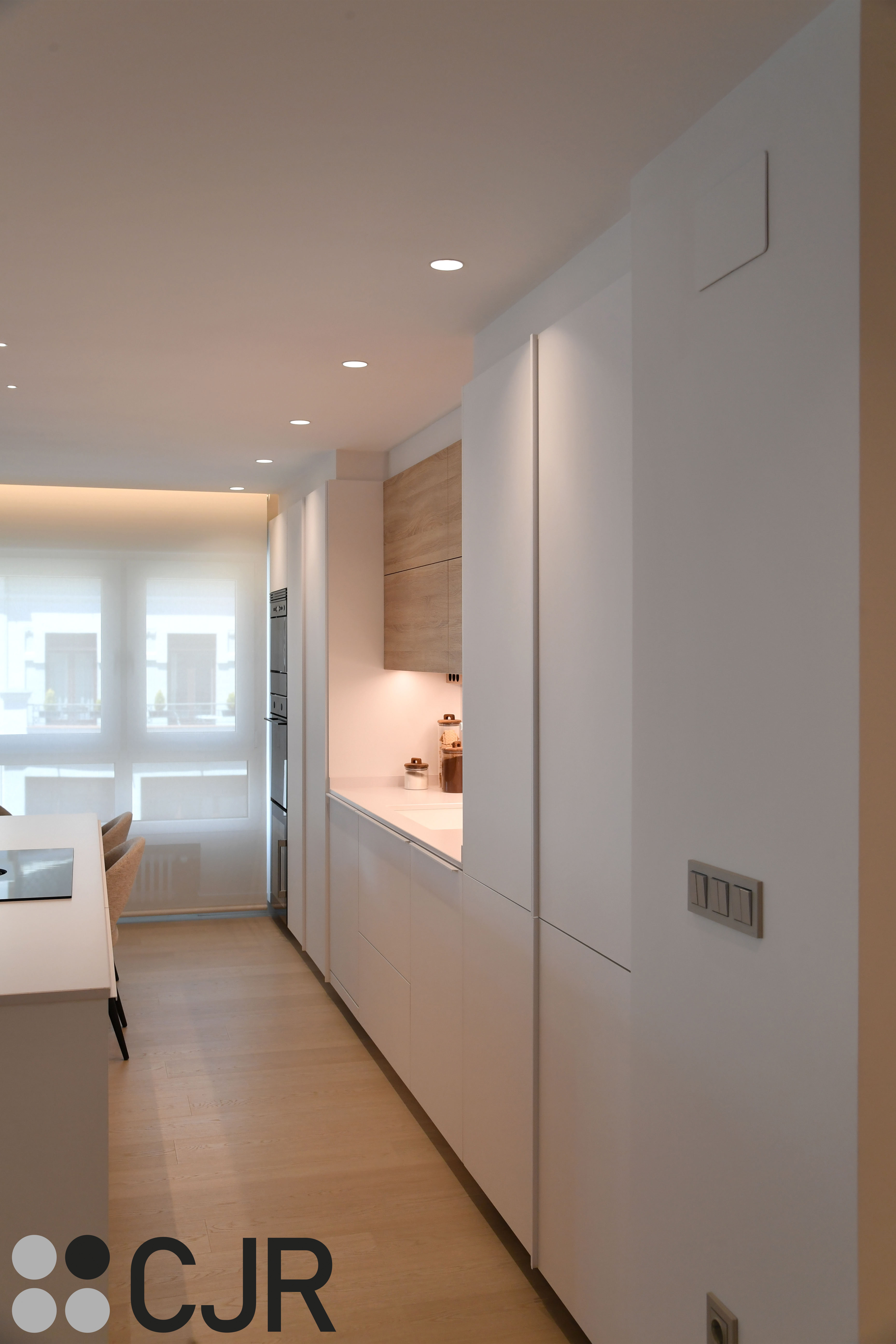 Cocina nórdica blanca y madera abierta con isla Cocinas CJR